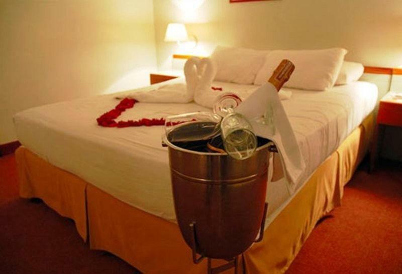 Hotel Cristina Suites Puerto La Cruz Pokoj fotografie